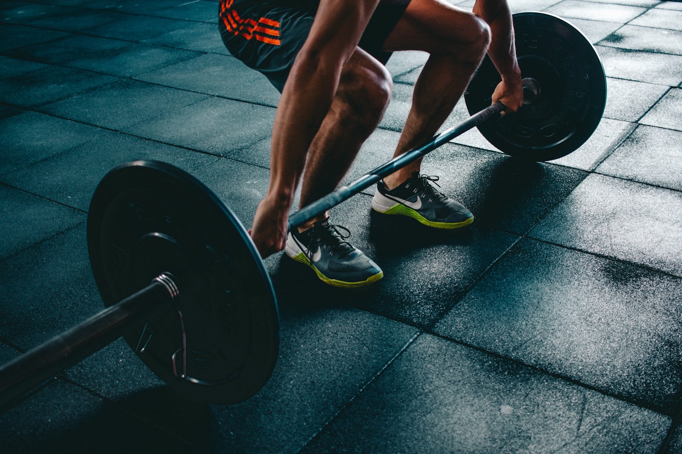 Athlete under a loaded barbell